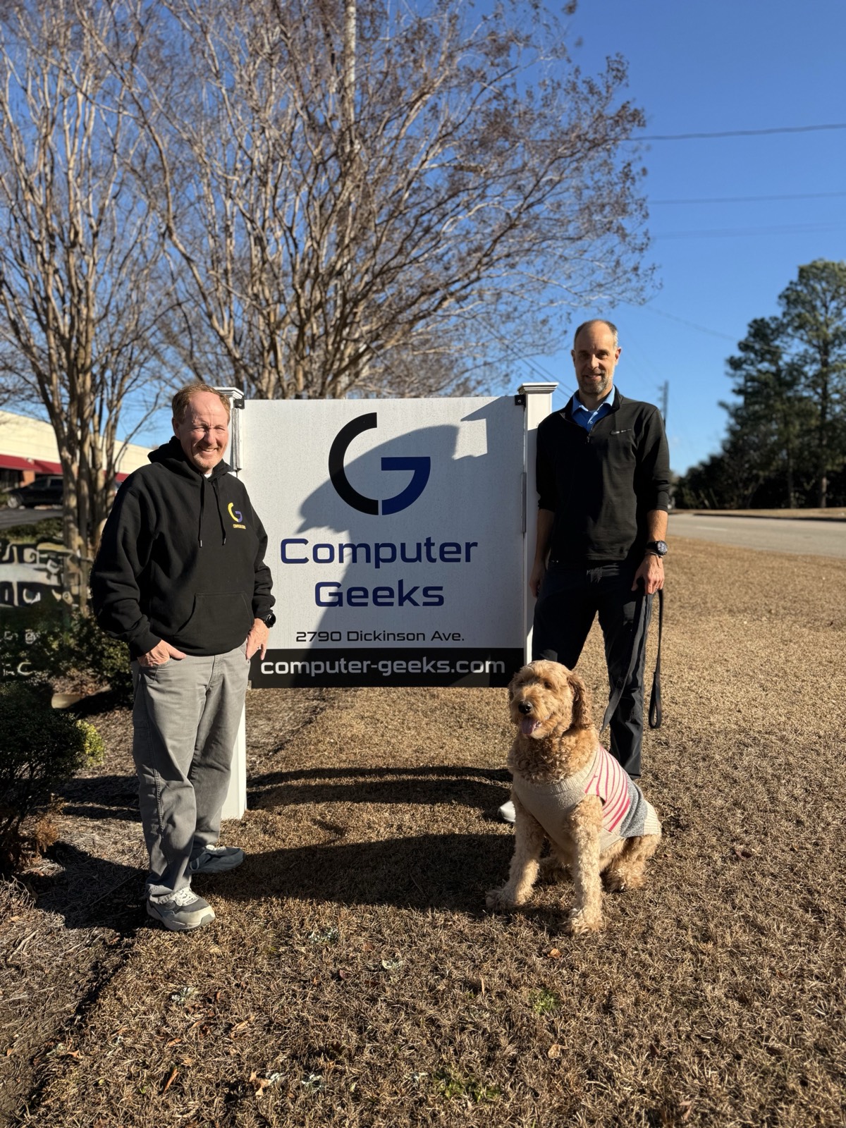 Parker and Bill, owners of Computer Geeks, with Mila